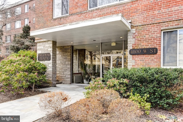 entrance to property with brick siding