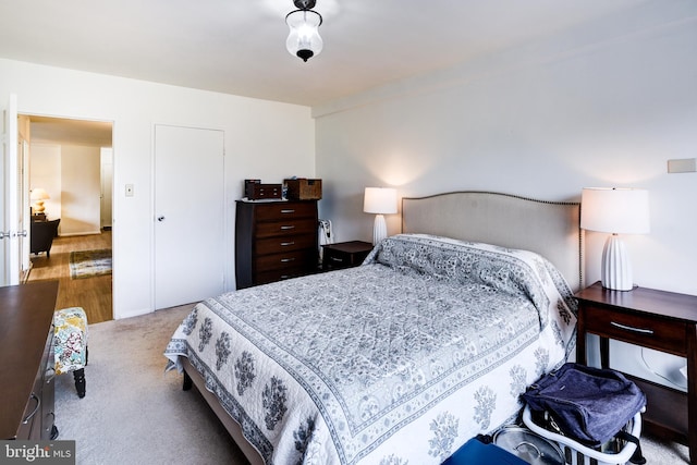 bedroom with light colored carpet