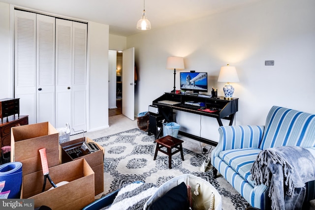 home office featuring baseboards and light colored carpet