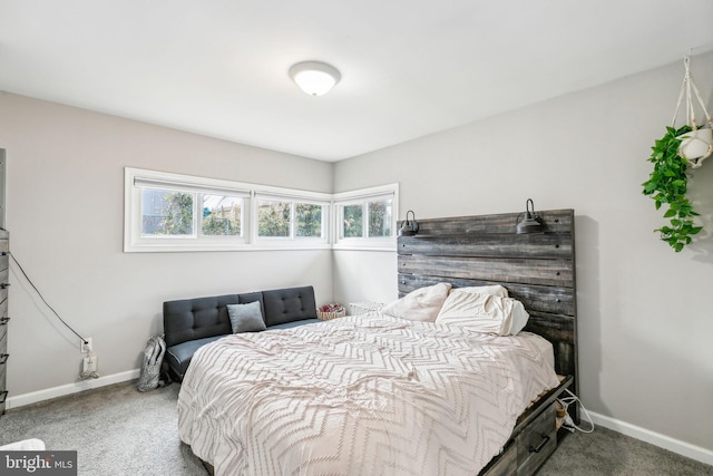 carpeted bedroom featuring baseboards