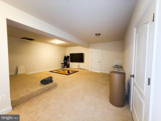 exercise area with carpet, visible vents, and baseboards