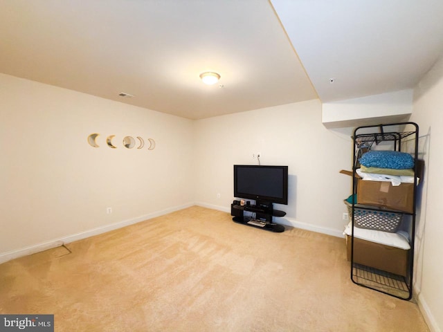 finished basement with carpet flooring, visible vents, and baseboards