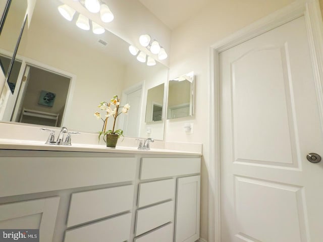 full bath featuring double vanity and a sink