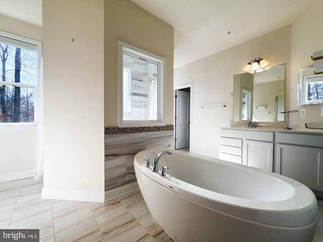 full bath with a bathtub and vanity