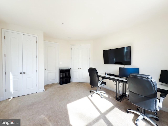 office area with carpet flooring and baseboards