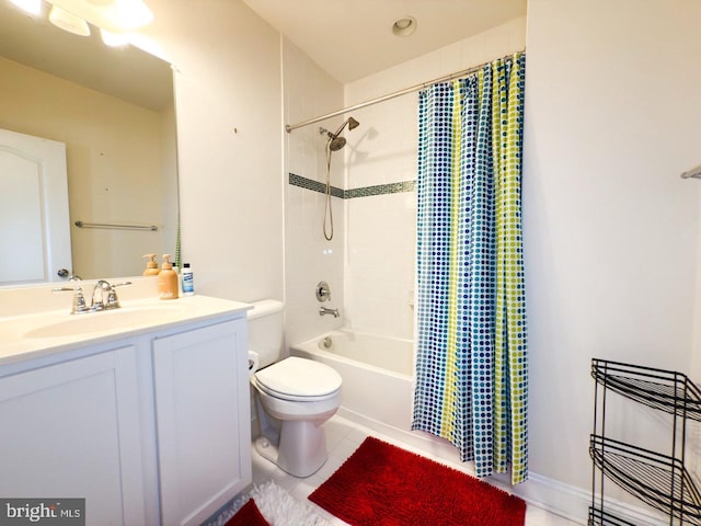 bathroom featuring tile patterned floors, shower / tub combo, toilet, and vanity