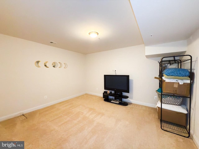 interior space featuring visible vents, baseboards, and carpet floors