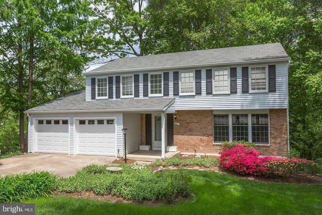 view of front of home featuring concrete driveway, an attached garage, and brick siding