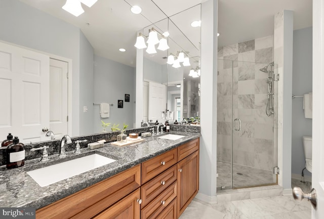 full bath with a stall shower, marble finish floor, a sink, and toilet