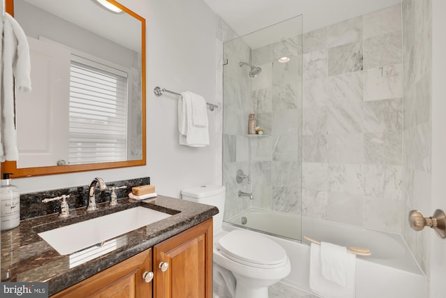 full bathroom featuring toilet, bathtub / shower combination, and vanity