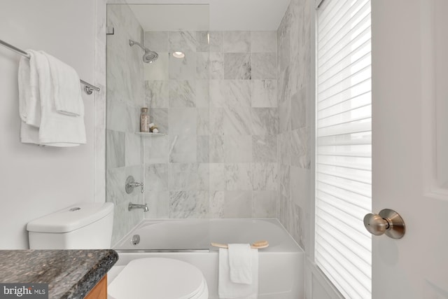 bathroom featuring toilet, shower / bath combination, and vanity