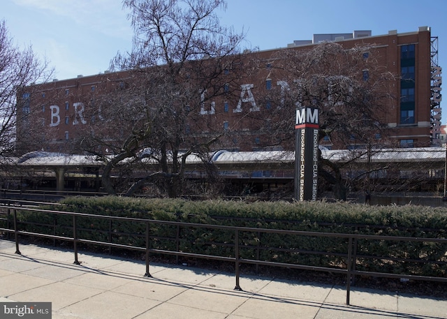 view of building exterior with fence