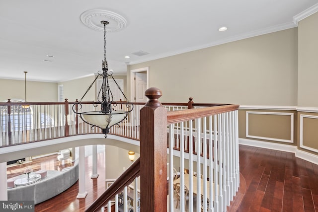 interior space featuring visible vents, wainscoting, ornamental molding, dark wood-type flooring, and recessed lighting