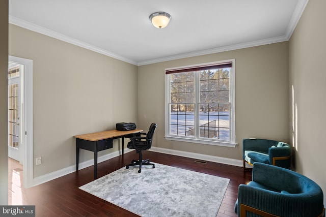 office featuring dark wood-style floors, baseboards, visible vents, and ornamental molding