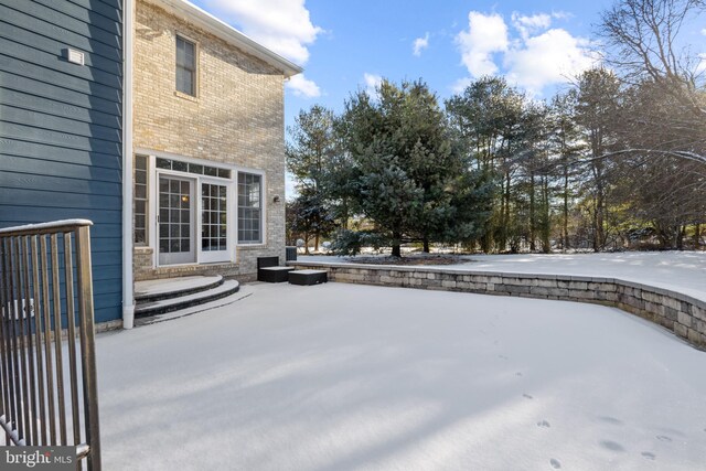 view of snow covered patio