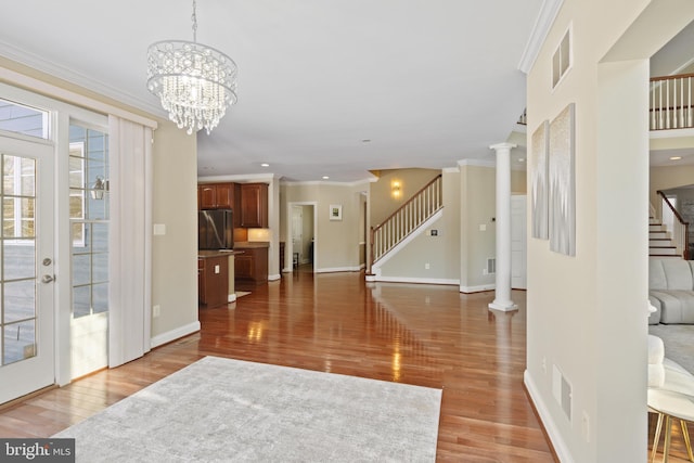 interior space with stairs, visible vents, and ornamental molding
