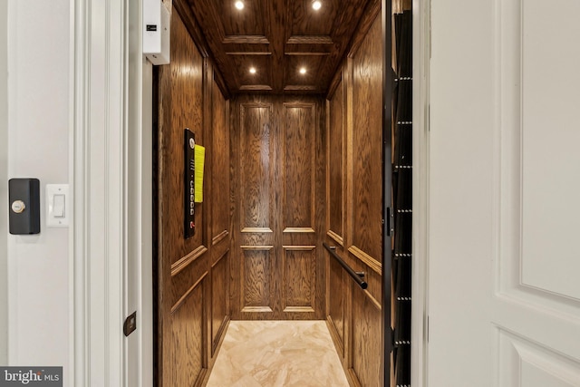 details featuring recessed lighting, wood walls, coffered ceiling, beam ceiling, and elevator