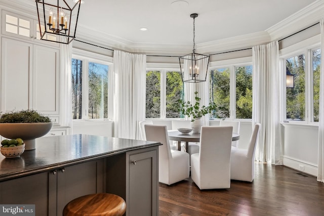 sunroom / solarium with visible vents and a notable chandelier