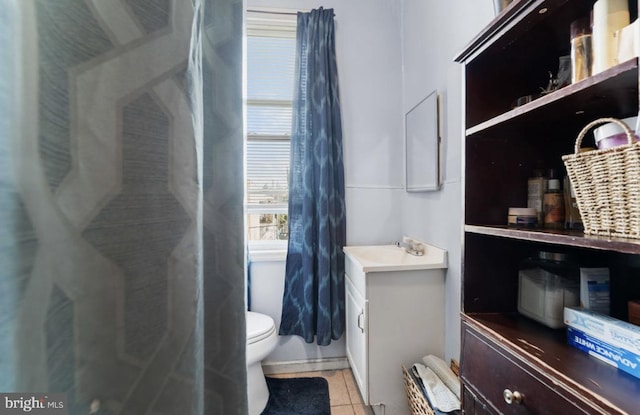 full bath featuring toilet, tile patterned flooring, and vanity