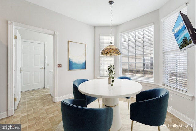 dining room featuring baseboards