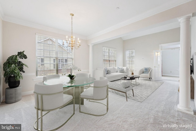 dining space featuring decorative columns, ornamental molding, and light colored carpet