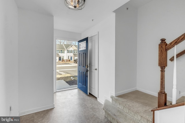 corridor with stairway and baseboards