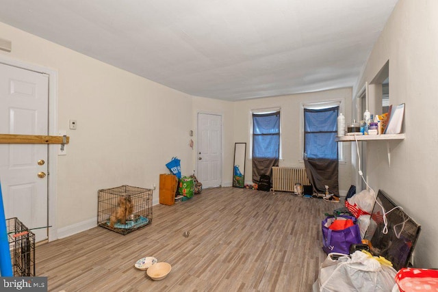 interior space featuring radiator and wood-type flooring