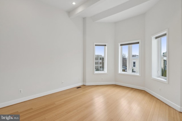 spare room with recessed lighting, baseboards, visible vents, and light wood finished floors