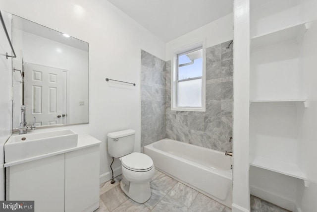 bathroom with baseboards, tub / shower combination, vanity, and toilet