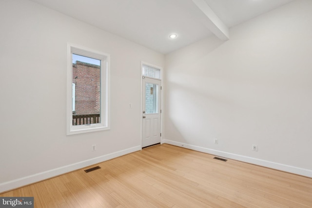 entryway with baseboards, visible vents, wood finished floors, and recessed lighting