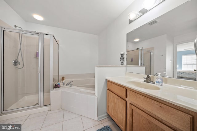 bathroom featuring separate shower and tub, tile patterned flooring, and vanity