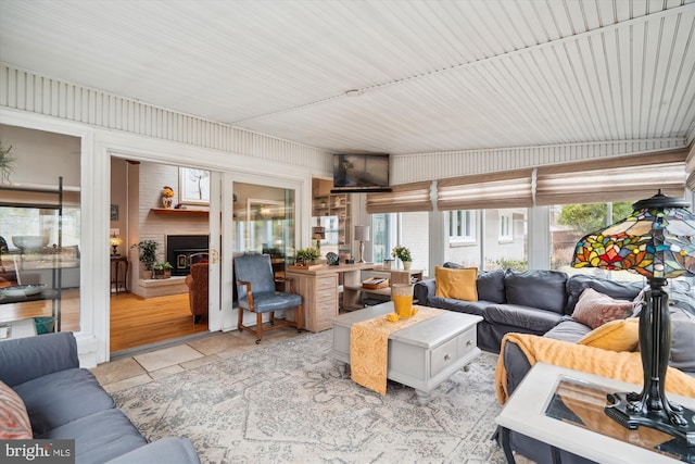 living room featuring a large fireplace