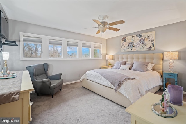 carpeted bedroom featuring ceiling fan and baseboards