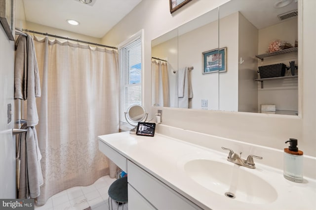 bathroom with vanity and visible vents