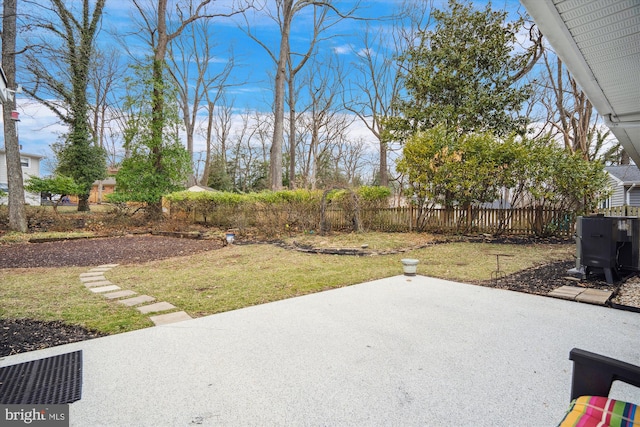 view of yard featuring a patio and fence