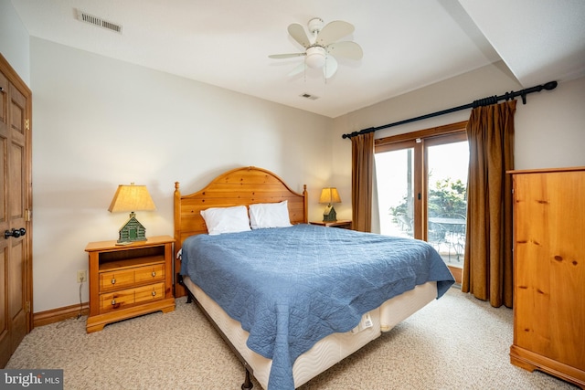 bedroom with access to outside, visible vents, baseboards, and light colored carpet