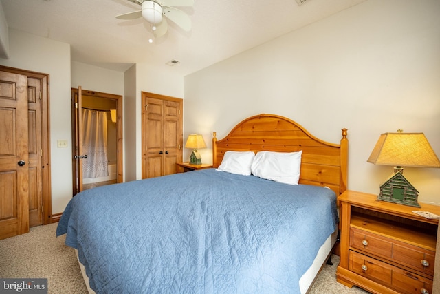 bedroom with light carpet and a ceiling fan