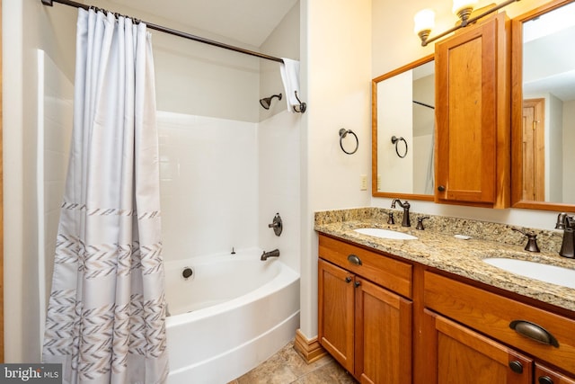 full bathroom featuring shower / tub combo, a sink, and double vanity