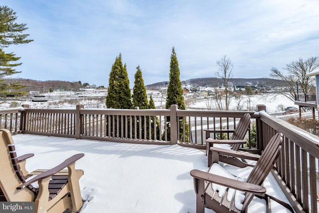 view of snow covered deck