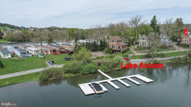 aerial view with a residential view and a water view