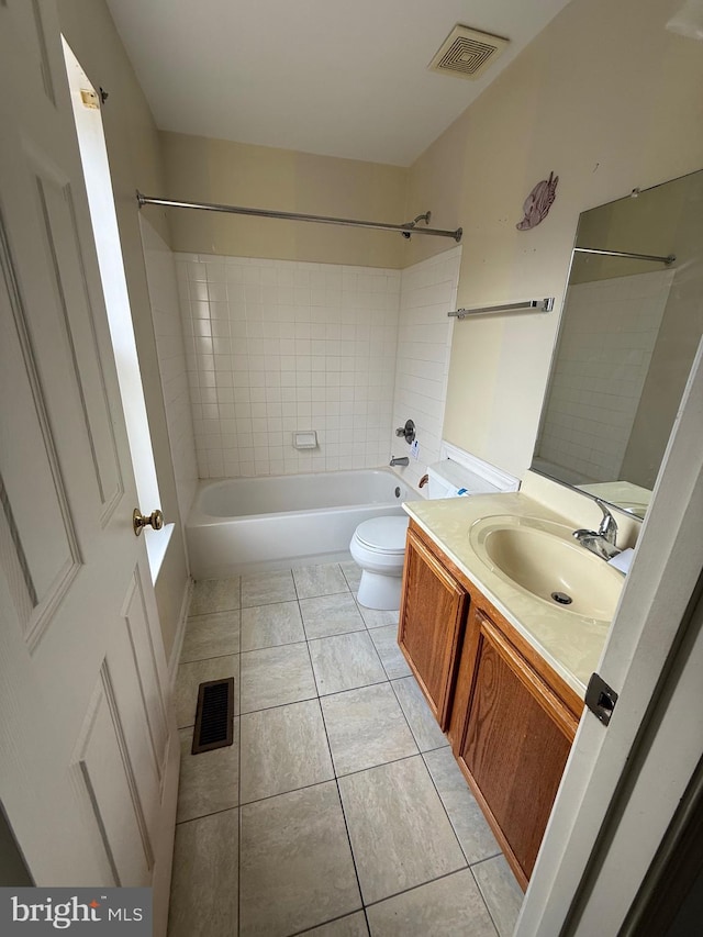 full bathroom featuring visible vents, toilet, vanity, and tile patterned flooring