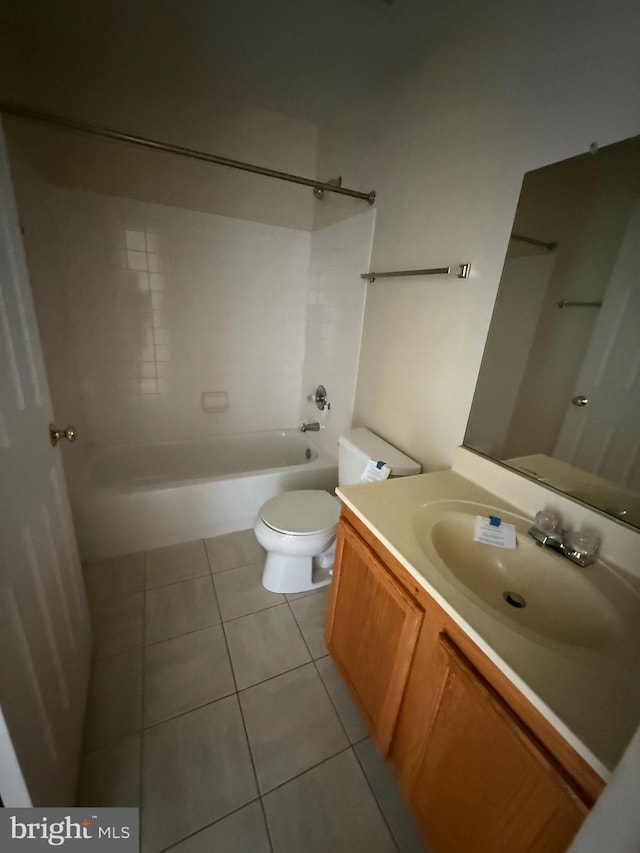 bathroom featuring vanity, tile patterned floors, toilet, and shower / tub combination