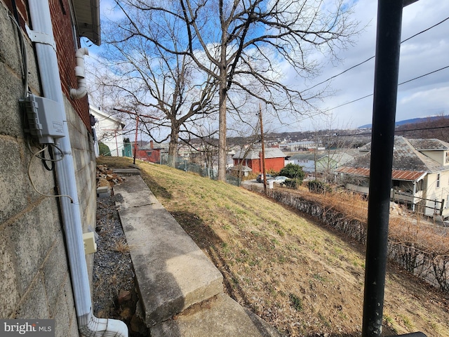 view of yard with a residential view and fence