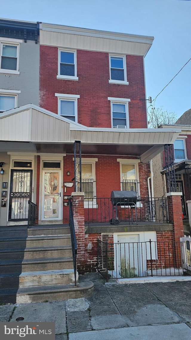 multi unit property featuring covered porch