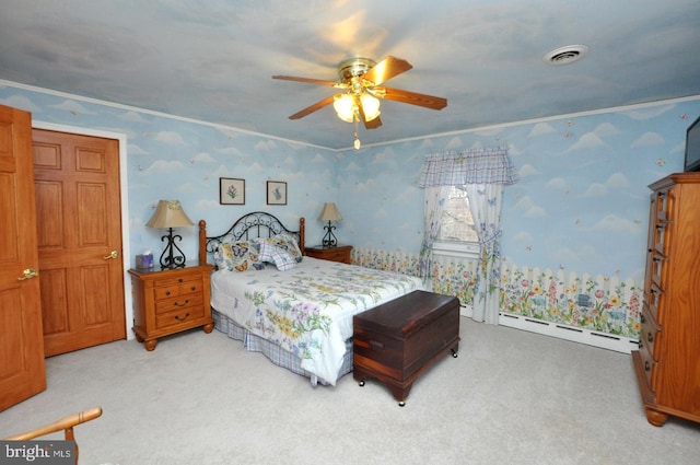 carpeted bedroom with a baseboard heating unit, a ceiling fan, visible vents, and wallpapered walls