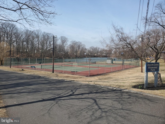 view of sport court with fence