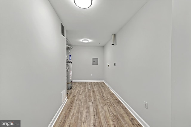 washroom featuring laundry area, light wood finished floors, visible vents, baseboards, and washer hookup