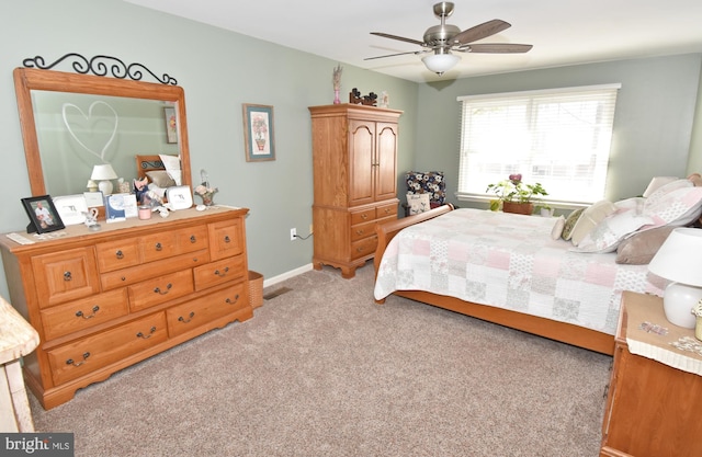 bedroom with baseboards, a ceiling fan, and light colored carpet