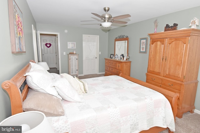 bedroom featuring light carpet and ceiling fan