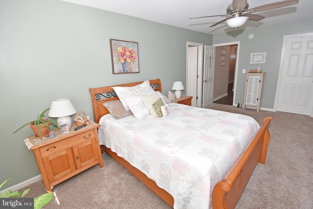 bedroom with light carpet, ceiling fan, and baseboards